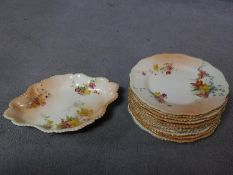 A set of eleven 1898 Royal Worcester hand painted floral design on blush ivory porcelain dinner