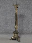 An antique silver plated floor standing ecclesiastical candlestick. H.76cm