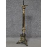 An antique silver plated floor standing ecclesiastical candlestick. H.76cm