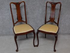 A pair of Edwardian mahogany and satinwood inlaid dining chairs on cabriole supports. H.97cm