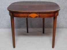 A Georgian mahogany and satinwood inlaid foldover top tea table. H.71 W.91 D.92cm