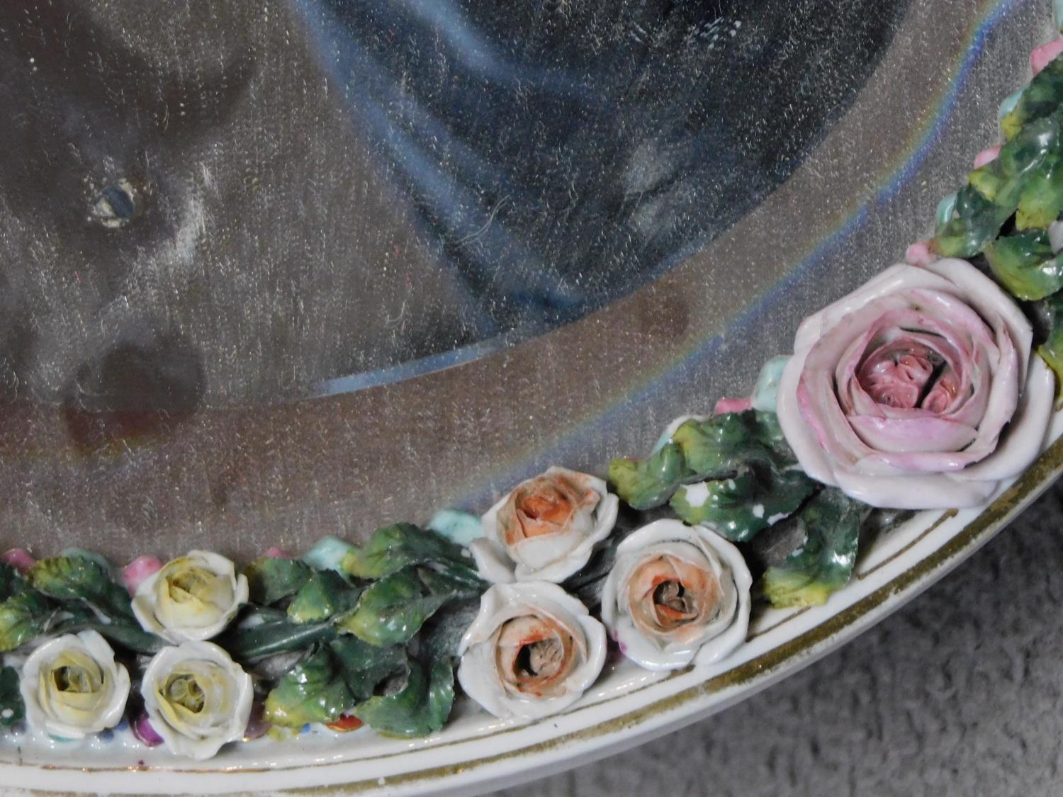 A 19th century Sitzendorf style oval shaped porcelain dressing mirror with relief flower and - Image 3 of 4