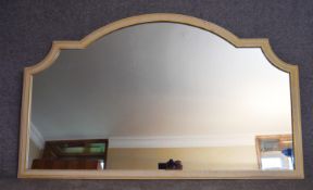 A mid 20th century arched white painted overmantel mirror. H.85x137cm