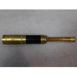 An antique brass telescope. W.32cm