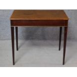 A Georgian mahogany lamp table on square section tapering supports. H.71 W.78 D.49cm