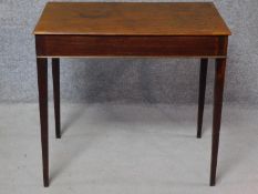 A Georgian mahogany lamp table on square section tapering supports. H.71 W.78 D.49cm