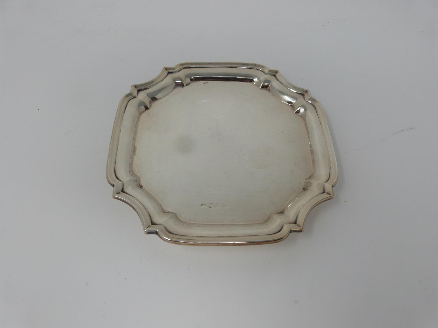 An octagonal silver four footed mint dish. With ball and claw form feet. Hallmarked FLR. Diameter