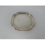 An octagonal silver four footed mint dish. With ball and claw form feet. Hallmarked FLR. Diameter