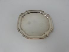 An octagonal silver four footed mint dish. With ball and claw form feet. Hallmarked FLR. Diameter