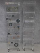 A perspex display cabinet with four open shelves together with a larger example. H.163 W.42 D.41cm