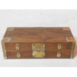 A 19th century Chinese hardwood brass bound table top chest of two long drawers. H.15 W.50 D.22cm