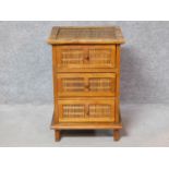 An Eastern teak and bamboo small chest of drawers. H.66 W.44 D.41cm