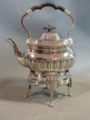 An antique Walker and Hall silver plate spirit kettle and stand. With dragooned detailing, scalloped