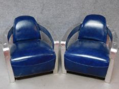 A pair of vintage style aviator armchairs in azure leather upholstery. H.74 W.73 D.83cm