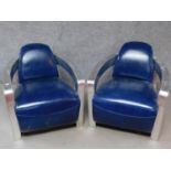 A pair of vintage style aviator armchairs in azure leather upholstery. H.74 W.73 D.83cm