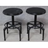 A pair of industrial style adjustable metal stools. H.87cm (full height).