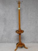 A late 19th century oak coat and umbrella stand on tripod cabriole supports. H.167cm