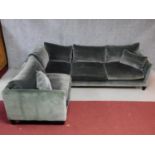 A three section corner sofa in grey velour upholstery. H.70 W.275 (long end) W.215 (short end) D.