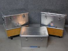 Three lidded aluminium industrial containers, two converted to a pair of occasional tables. H.64 W.