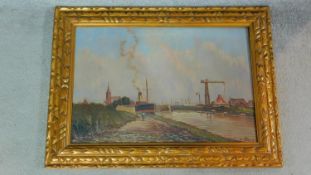 A carved gilt framed oil on canvas by Belgian artist Edouard de Block. Depicting a river bank with a