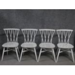 A set of four vintage white painted Ercol style dining chairs, British Standards kitemark stamped to