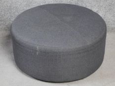 A grey upholstered Camerich Puck footstool. H.30 W.65 D.65cm