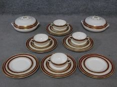 A vintage Keeling and Co, Losolware, Burslem maroon and gilded design part dinner service. Makers