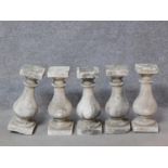 A set of five concrete garden balusters H.47cm