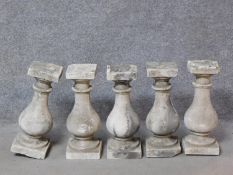 A set of five concrete garden balusters H.47cm