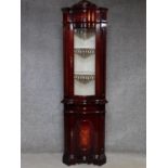 An Italian antique style corner display cabinet with glazed top and floral inlay above frieze drawer