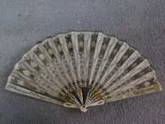 A French 'Directoire' Fan, the ivory guard with carved and painted foliate decoration, the cream
