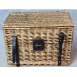 A Harrods wicker hamper basket. H.38 W.56 D.38cm