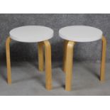 A pair of Artek footstools by Alvar Aalto. H.44cm