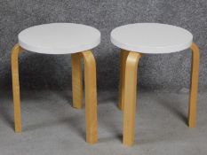 A pair of Artek footstools by Alvar Aalto. H.44cm