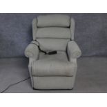 A Leggett & Platt reclining armchair with fully motorised back and footrest. H.105cm