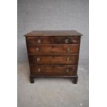 A small Georgian mahogany chest of two short over three long drawers on bracket feet. H.85x83x50cm