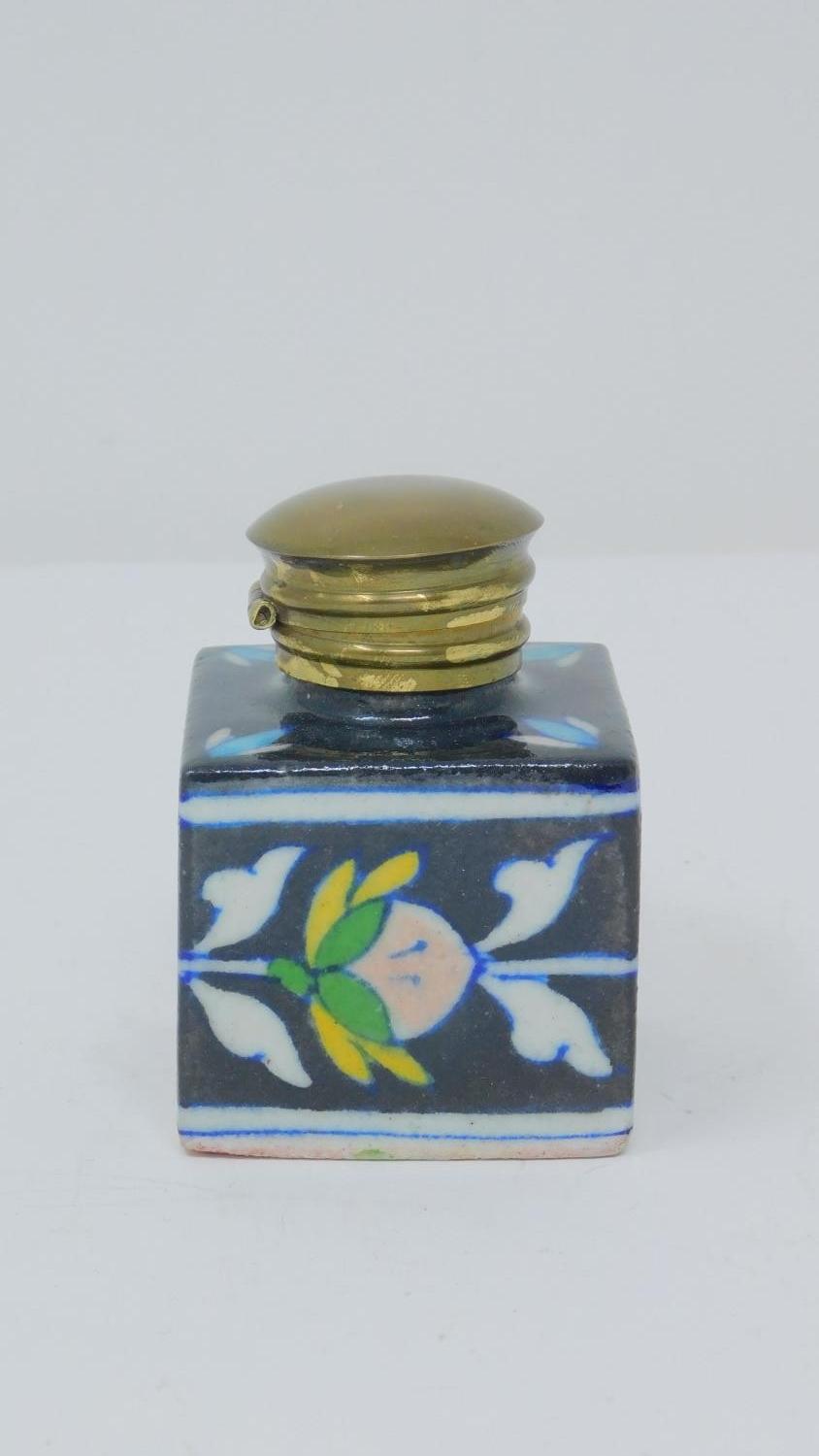 An antique glazed ceramic perfume bottle with brass lid, decorated with a stylized floral and - Image 2 of 5