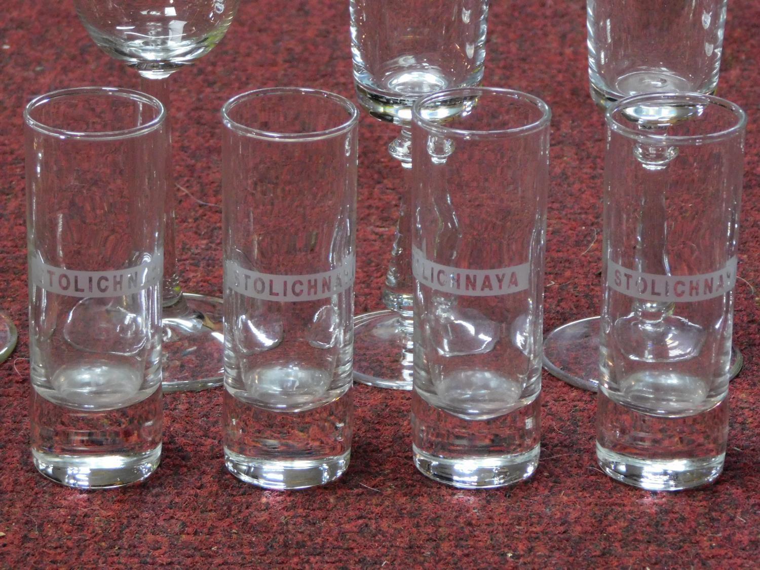 A collection of vintage glasses including a set of six brandy glasses, four engraved shot glasses, a - Image 3 of 6