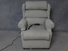 A Leggett & Platt reclining armchair with fully motorised back and footrest. H.103cm