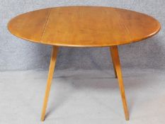 A vintage style beech framed drop flap dining table. H.72 W.124 D.124cm