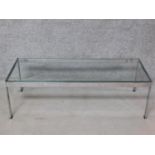A vintage chrome framed Merrow Associates low coffee table with plate glass top. H.36 W.114 D.46cm