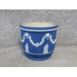 An antique Jasperware blue and white Wedgwood planter. Decorated with vine garlands, lion head