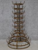 A metal framed multi tier bottle rack. H.93cm