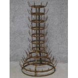 A metal framed multi tier bottle rack. H.93cm