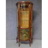 A Louis XV Vernis Martin style display cabinet with ormolu mounts and decorative panels depicting