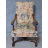 A William and Mary style walnut armchair on turned tapering stretchered supports. H.110cm
