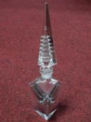 An Art Deco crystal perfume bottle with illusion cut pagoda stopper. H.26cm