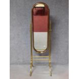 An early 20th century mahogany and brass framed cheval mirror with adjustable swing plate. 167x52cm
