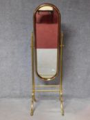 An early 20th century mahogany and brass framed cheval mirror with adjustable swing plate. 167x52cm