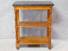 A marble topped fruitwood console table in the French Provincial style on turned front supports